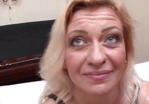 Stockings-wearing lady spit-roasted and facial'd